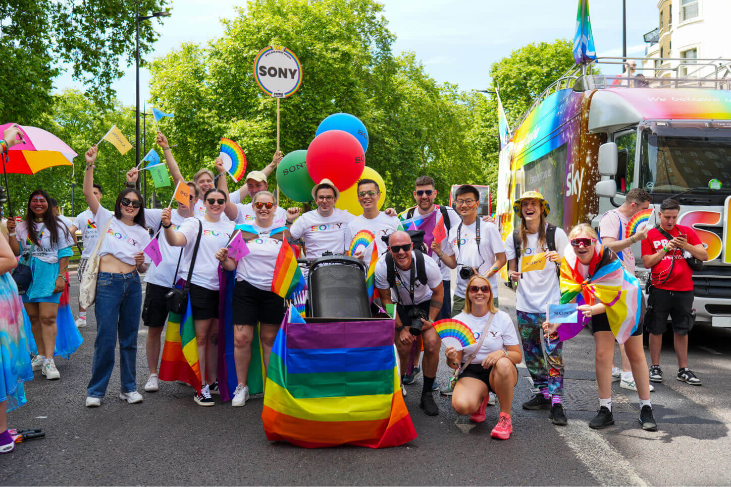 Group photo showing three Sony employees chatting over coffee
